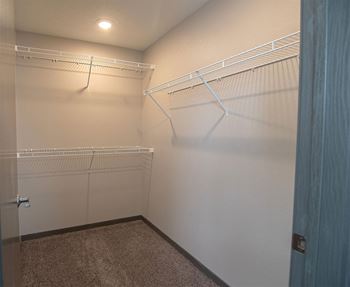 a large walk in closet in a bedroom